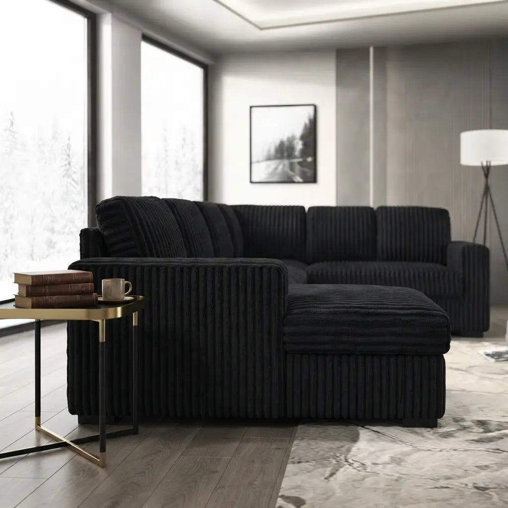 Modern corduroy sofa bed close-up showing soft black fur corduroy fabric texture and built-in USB charging station