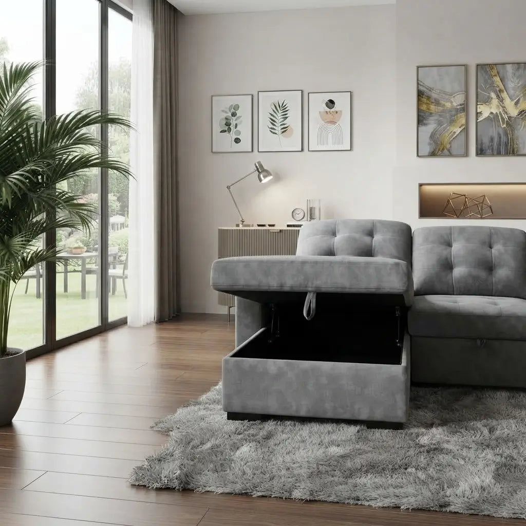 Close-up of grey tufted upholstery and built-in chrome cup holders on sectional armrest