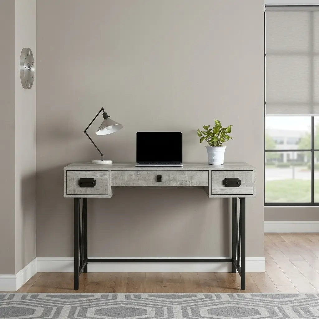 Brown thick-panel desk with warm laminate finish, three storage drawers, and uniquely designed black metal legs in a modern workspace