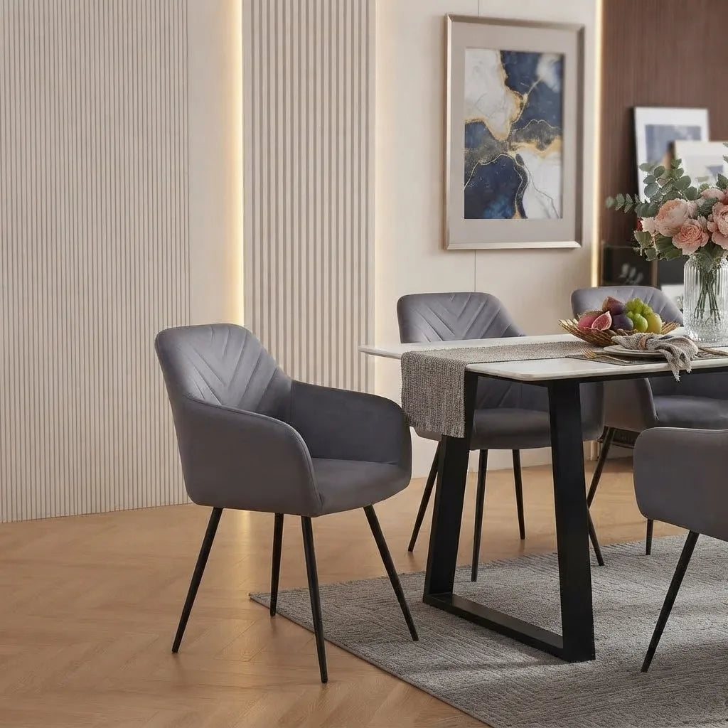7-Piece Sintered Stone Dining Set displayed with textured blue-grey velvet armchairs featuring elegant vertical channel stitching and tapered black steel legs