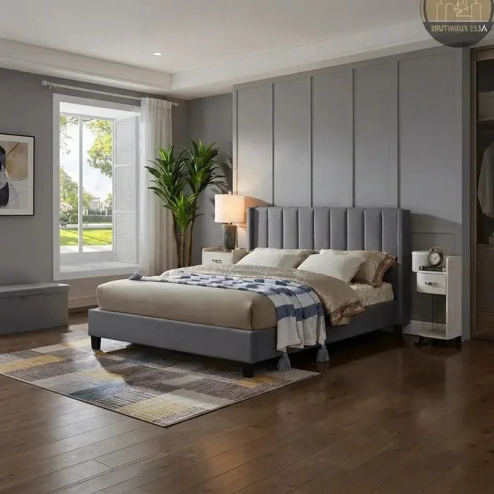 Grey channel tufted velvet platform bed styled with neutral bedding