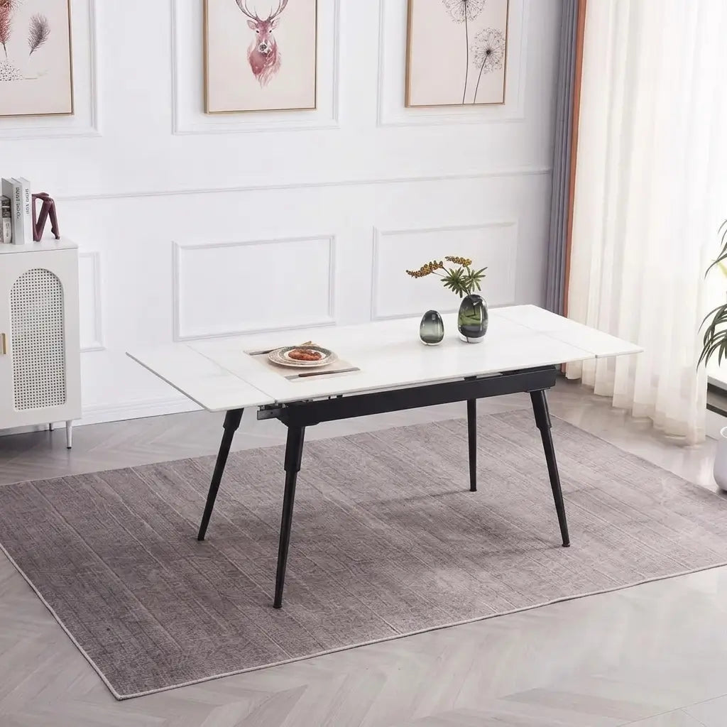 7-Piece Modern Glass Top Dining Set displayed with black metal legs, gold accent details, and soft grey tufted velvet dining chairs