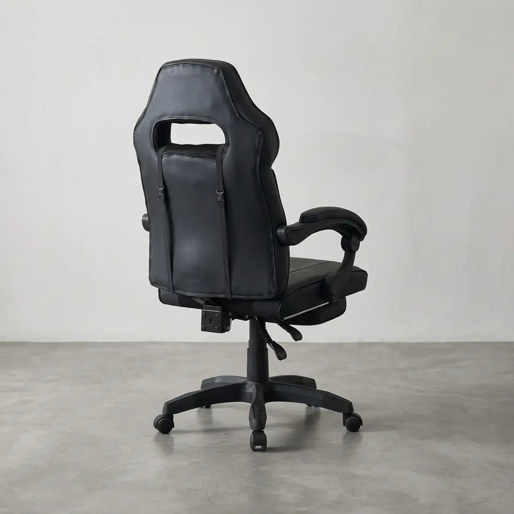 Black faux leather high-back racing style gaming chair with diamond-stitched back cushion, padded curved armrests, and heavy-duty 5-star rolling base