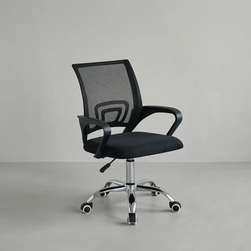 Contemporary black swivel chair with breathable mesh backrest and sturdy chrome base at a desk