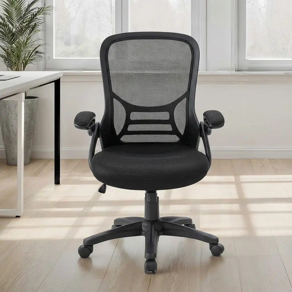 Contemporary black mesh swivel chair with wide cushioned seat, padded armrests, and smooth-rolling hooded wheels at a desk