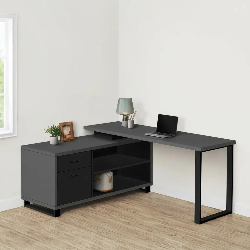 Front view of executive L-shaped home office desk styled with laptop and accessories