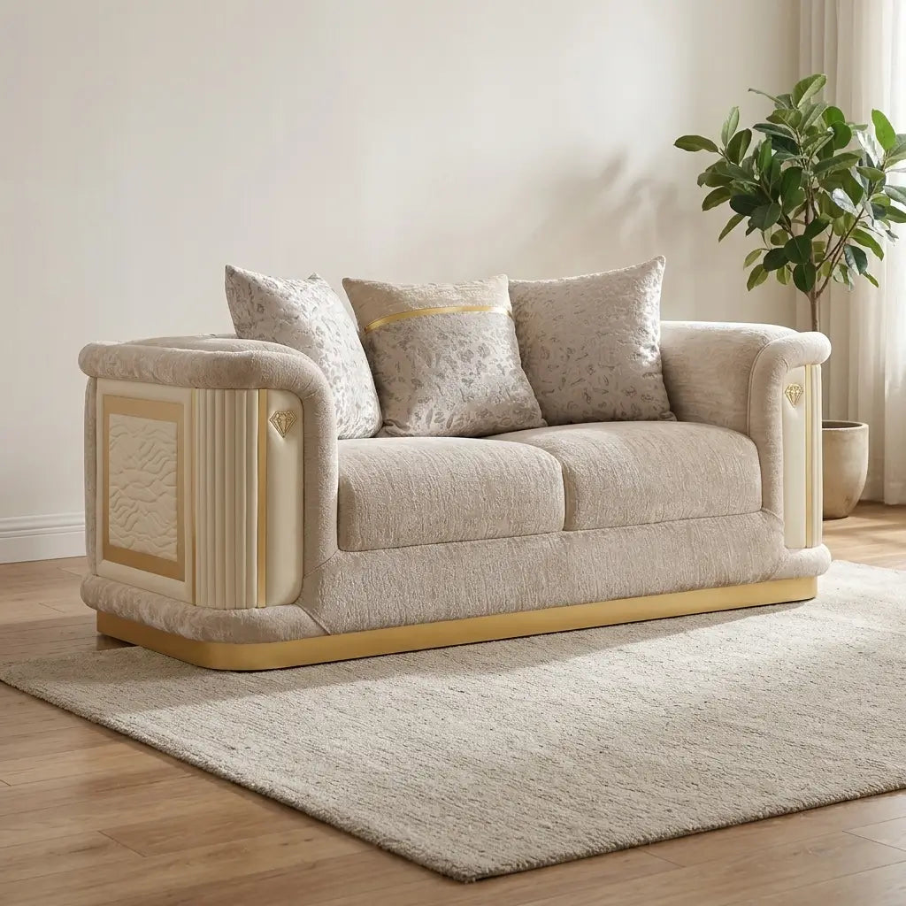 Elegant cream and gold loveseat sofa with textured beige cushions and decorative pillows on a light beige rug