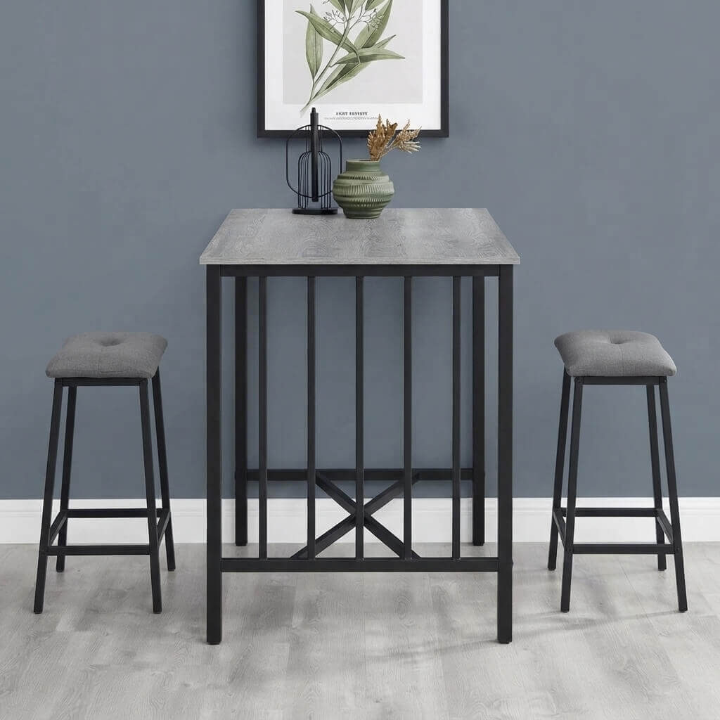 Counter-Height Dining Set with 2 Tufted Stools displayed with a white tabletop and tufted cushioned seats in a compact apartment setting