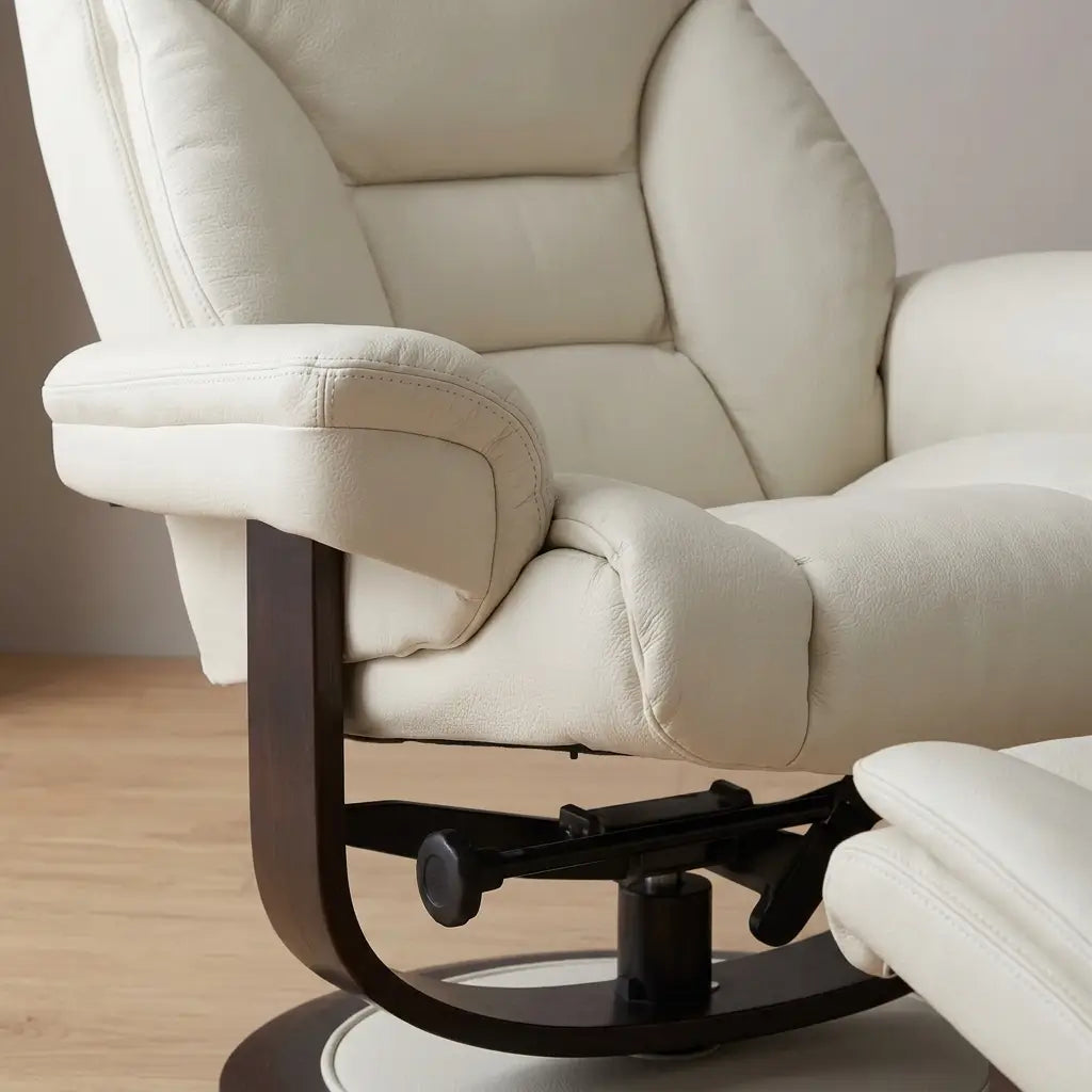 Scandinavian-inspired ivory-beige push-back recliner with matching ottoman and top grain leather match upholstery in a modern home