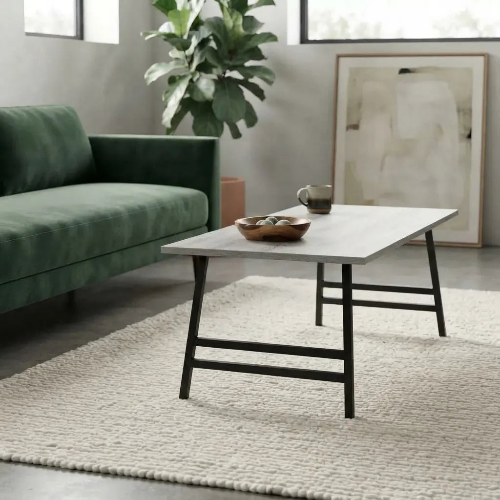 Modern grey rectangular coffee table with flared silver metal legs