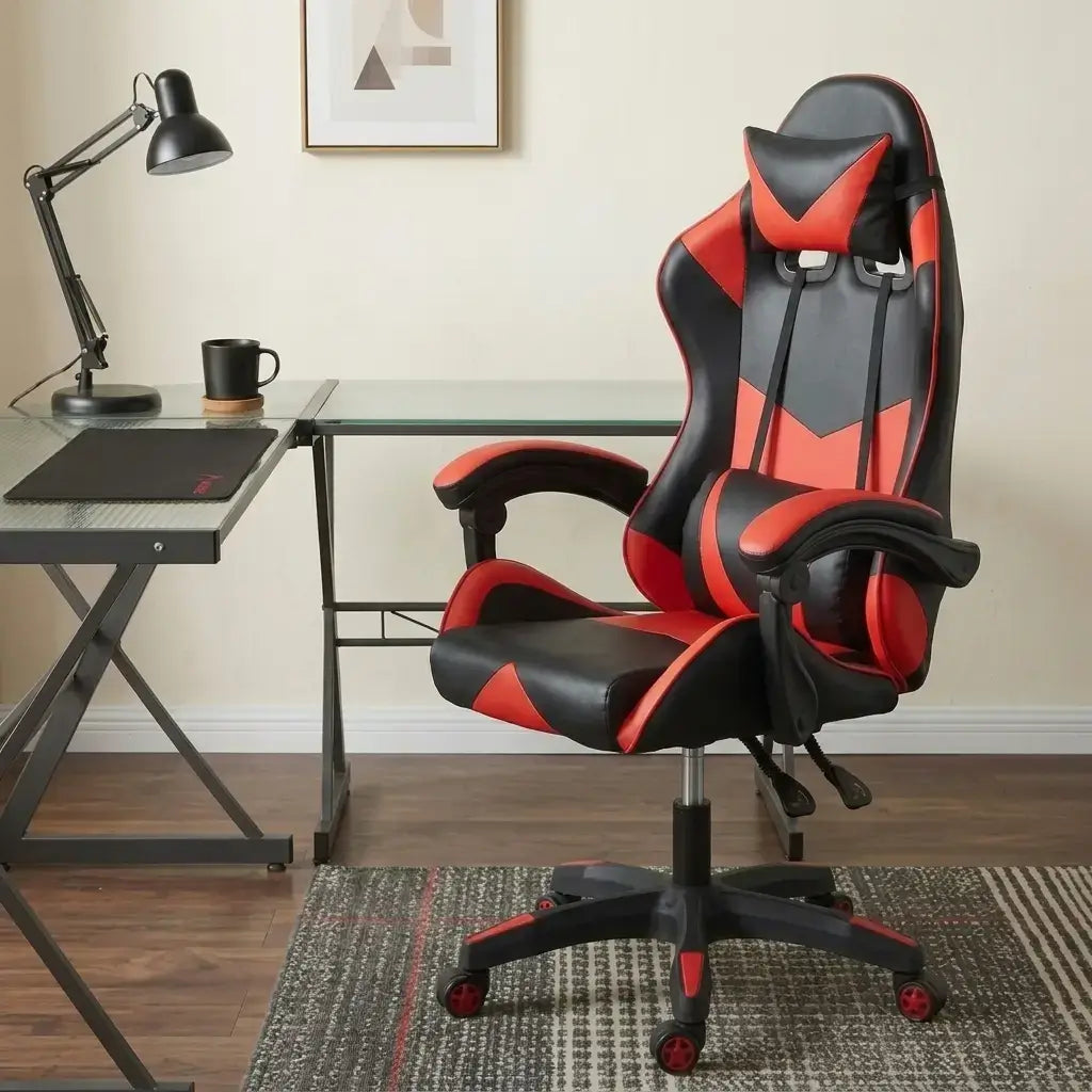 Red and black racing style gaming chair with removable headrest pillow, lumbar cushion, and butterfly seat plate
