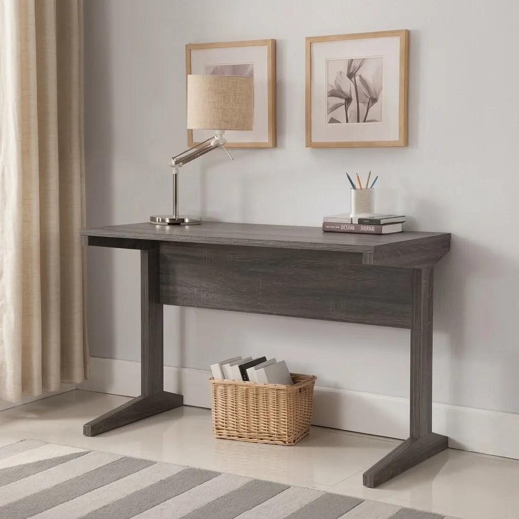 Low-angle detailed view highlighting the thick T-shaped wooden leg and side profile of a dark grey writing desk   