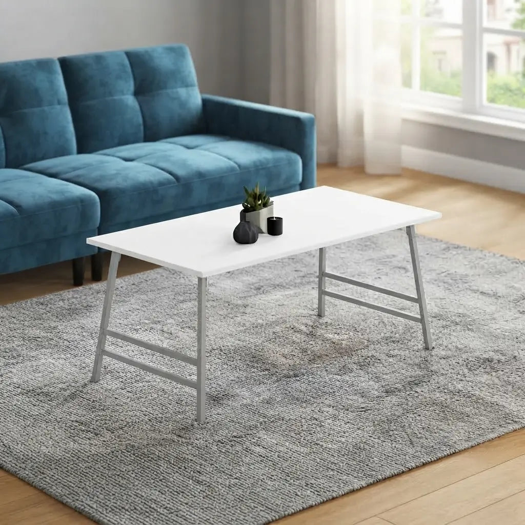 Clean white laminate coffee table on grey rug in bright living space