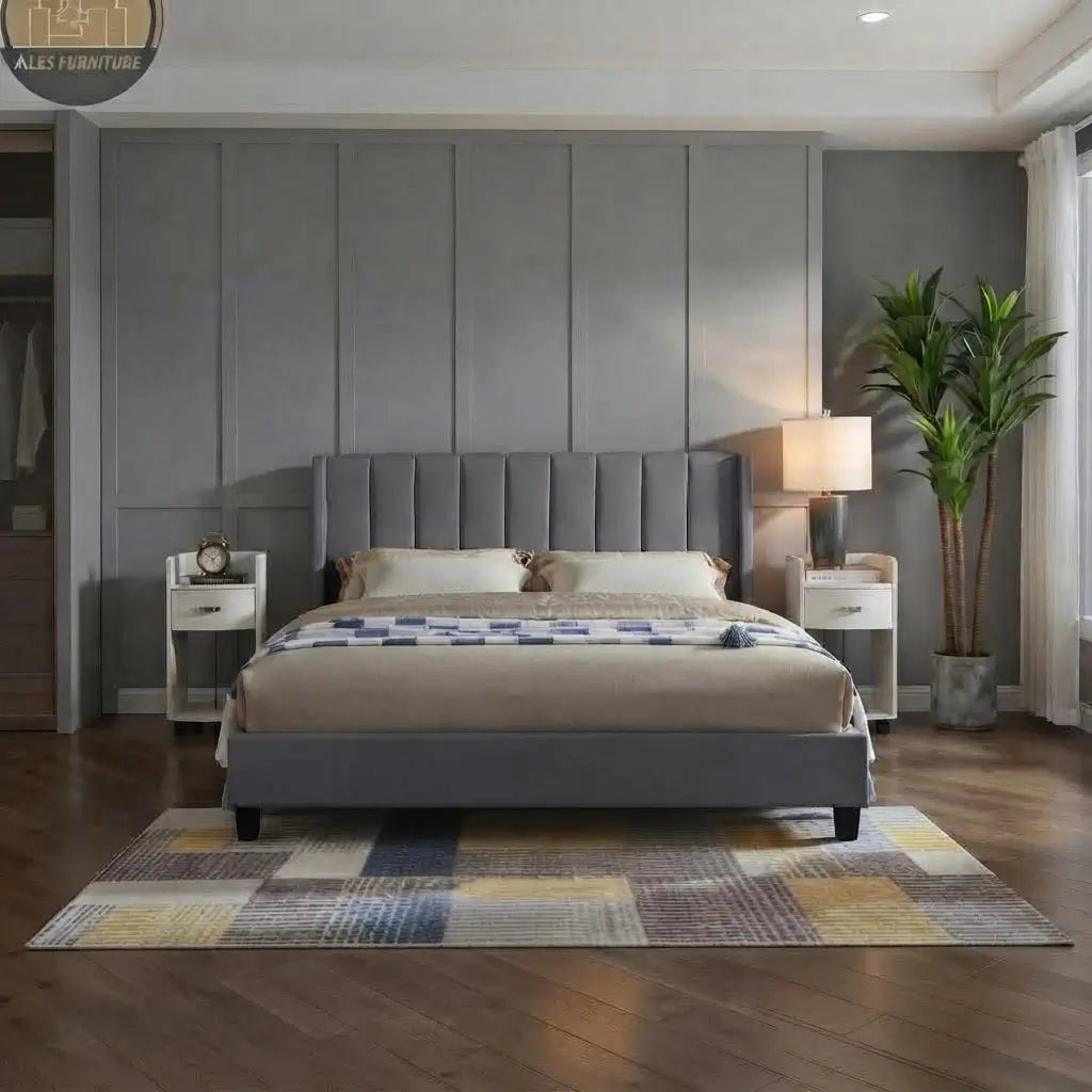 Close-up of deep vertical panel tufting on plush grey velvet headboard